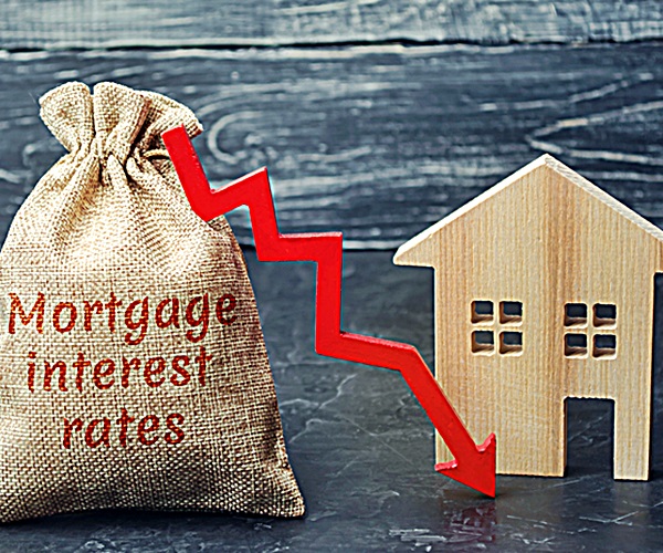 Bag with the money and the word Mortgage interest rates and arrow to down and house. Low interest in mortgages. Reducing interest payments for mortgages. The fall in housing rates on credit. Low housing demand